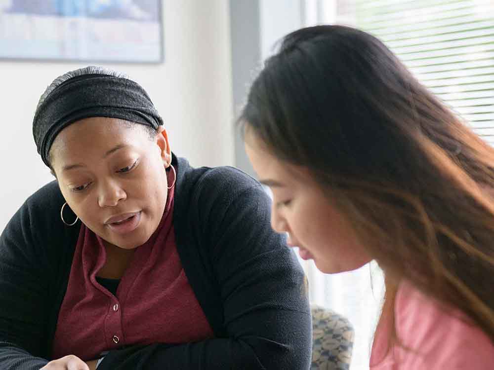 female advisor assisting female student