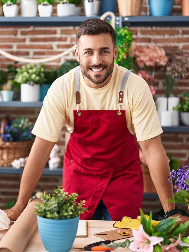 male entrepreneur smiling at camera