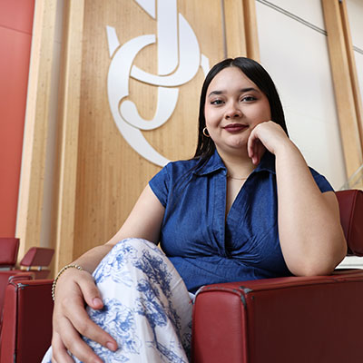 Promise Scholar Dariana Zavala sitting in a San Jacinto College building lobby