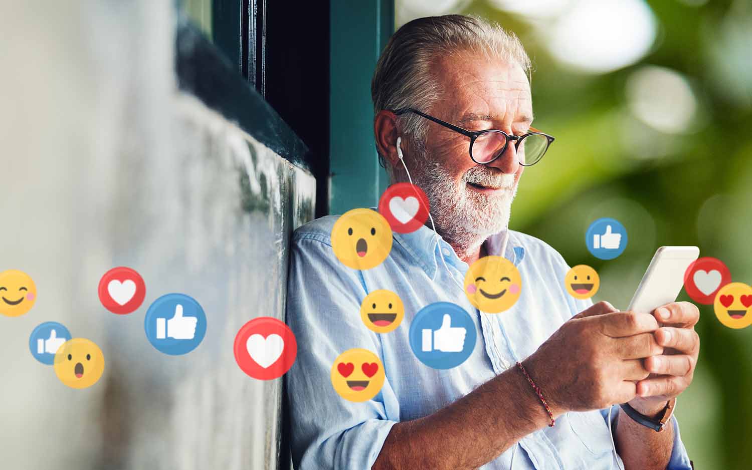 Senior gentleman using his cellphone for social media. 